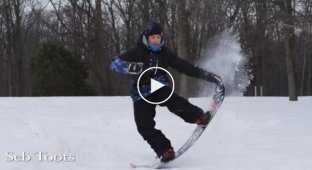 Профессиональный сноубордист показывает класс