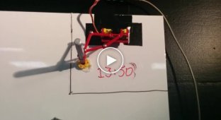 Робот-часовщик рисует время маркером на доске