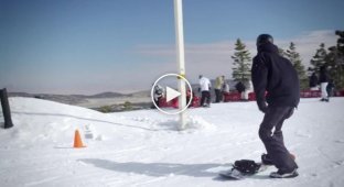 Необычный спуск с горы на сноуборде
