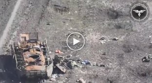 A Ukrainian FPV drone shot down two Russians near a destroyed armored personnel carrier somewhere in the east