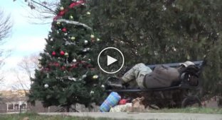 Men crept up to a sleeping homeless man and showered him with gifts