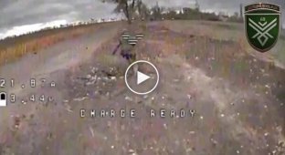 An occupier falls while running away from a kamikaze drone, and a moment later is hit in the head by a drone