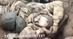 The bodies of liquidated occupiers lie in a trench at a Russian position