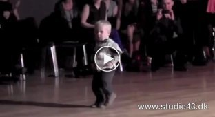 2 year old child has fun on the dance floor