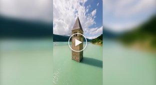 Lago di Resia is an artificially formed lake on the site of two natural lakes in the Val Venosta mountain valley