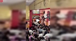 Crush at the temple: hundreds of pilgrims fight for entry to the sacred site