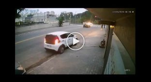 The car demolished a parked car, miraculously not hitting the driver