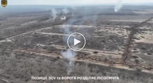 Ukrainian tank plows Russian trenches