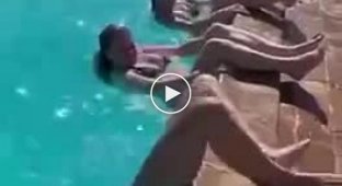 Girls trying to get out of the pool