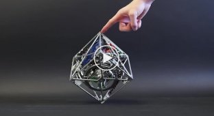 A Cube That Can Jump, Walk, and Stand on a Corner