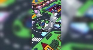 Augmented reality cars on a children's carpet with roads