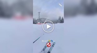 A snowboard rolled down a ski slope Slope without an owner