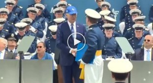 Joe Biden trips and falls to the floor during his graduation ceremony at the US Air Force Academy