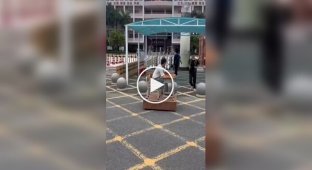 Chinese schoolchildren assemble a "riding" desk for moving around the city