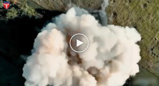 Ammunition detonates at an enemy field depot after a precise drone drop