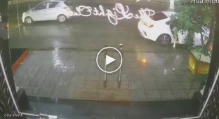 Fleeing from a thunderstorm, a woman crashed into a glass door