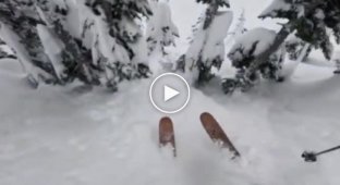 A skier rescued a snowboarder who fell into a snow well