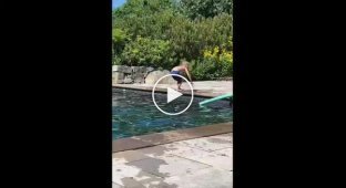 Child learning new tricks by the pool