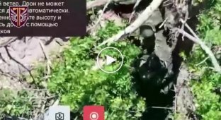 Russian invaders shoot at each other in a trench due to the conflict in the Kharkov direction
