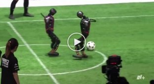 Beijing AI robots play 3-on-3 football