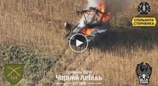 A Russian crawls on all fours from his burning armored vehicle and dies in a field