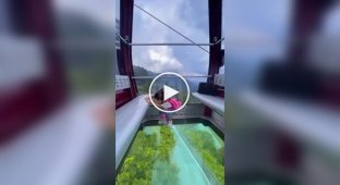 A ride in a lift cabin with a transparent floor
