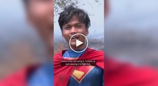 A teenager dressed as a superhero puts out fires in Indonesia