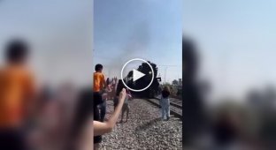 The train knocked the smartphone out of the girl's hands