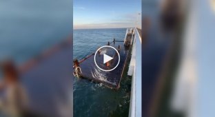 Sea waves and playing pier over the water