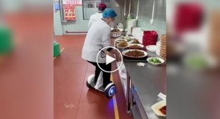In a Chinese restaurant, waiters move between tables not on foot, but on gyro scooters