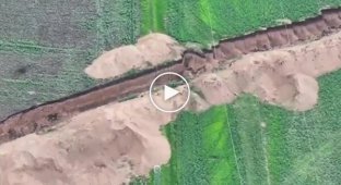 Russian motorized assault aircraft flies at full speed into an anti-tank ditch