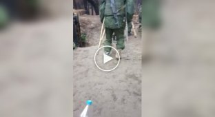 Two occupiers on crutches as part of an assault group go on a combat mission near Kremennaya