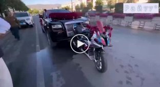 Rolls Royce caught up with the motorcycle and marred the wedding drive
