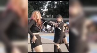 The girl looked at the girl’s dance and fell off her bike