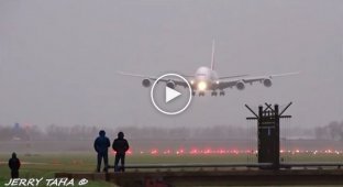 A video of two planes landing in strong winds in Amsterdam was posted online.