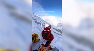 The Sherpa guide lit a cigarette at 8,000 meters.