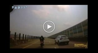 Dramatic confrontation between a biker and a passenger car in Taiwan