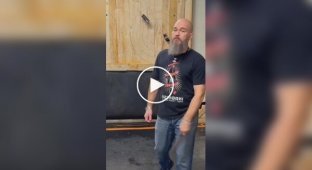 Right on target: man expertly throws knives and axes