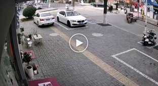 A scooter "threw off" the driver and flew into a building in China