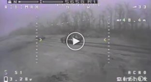 A kamikaze drone destroys a Russian armored personnel carrier along with troops on the armor