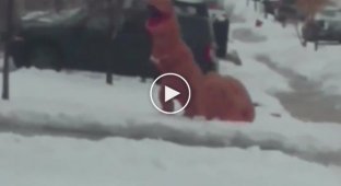 Two people in a dinosaur costume had a snowball fight