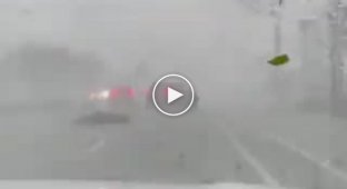 Oh, the car flew __ a tornado in Florida lifted a car into the air