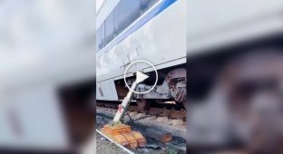 Lifting a derailed train car with a powerful jack