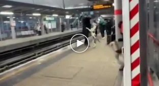 In London, a man almost got hit by a train while fleeing an angry American bully