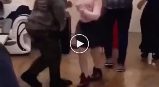 A chubby guy from Kazakhstan had a great time dancing with a girl