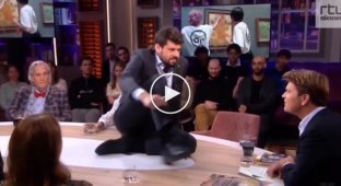 An eco-activist glued himself to a table on TV in the Netherlands, but it didn't help him