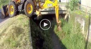 Acrobat backhoe loader and cleaning a canal