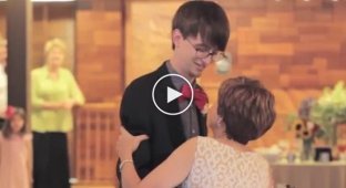 Funny and fiery dance of mother and son at a wedding