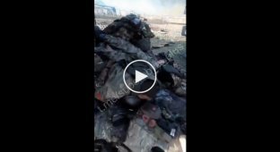 A pile of bodies of invaders liquidated during an attack by Ukrainian soldiers on a column of enemy equipment in the village of Gladkovka