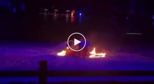 During a show, a dancer caught fire and jumped Into the water